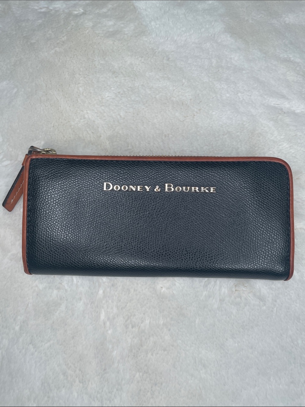 Dooney & Bourke Black Leather Zip-Around Wallet with Brown Trim